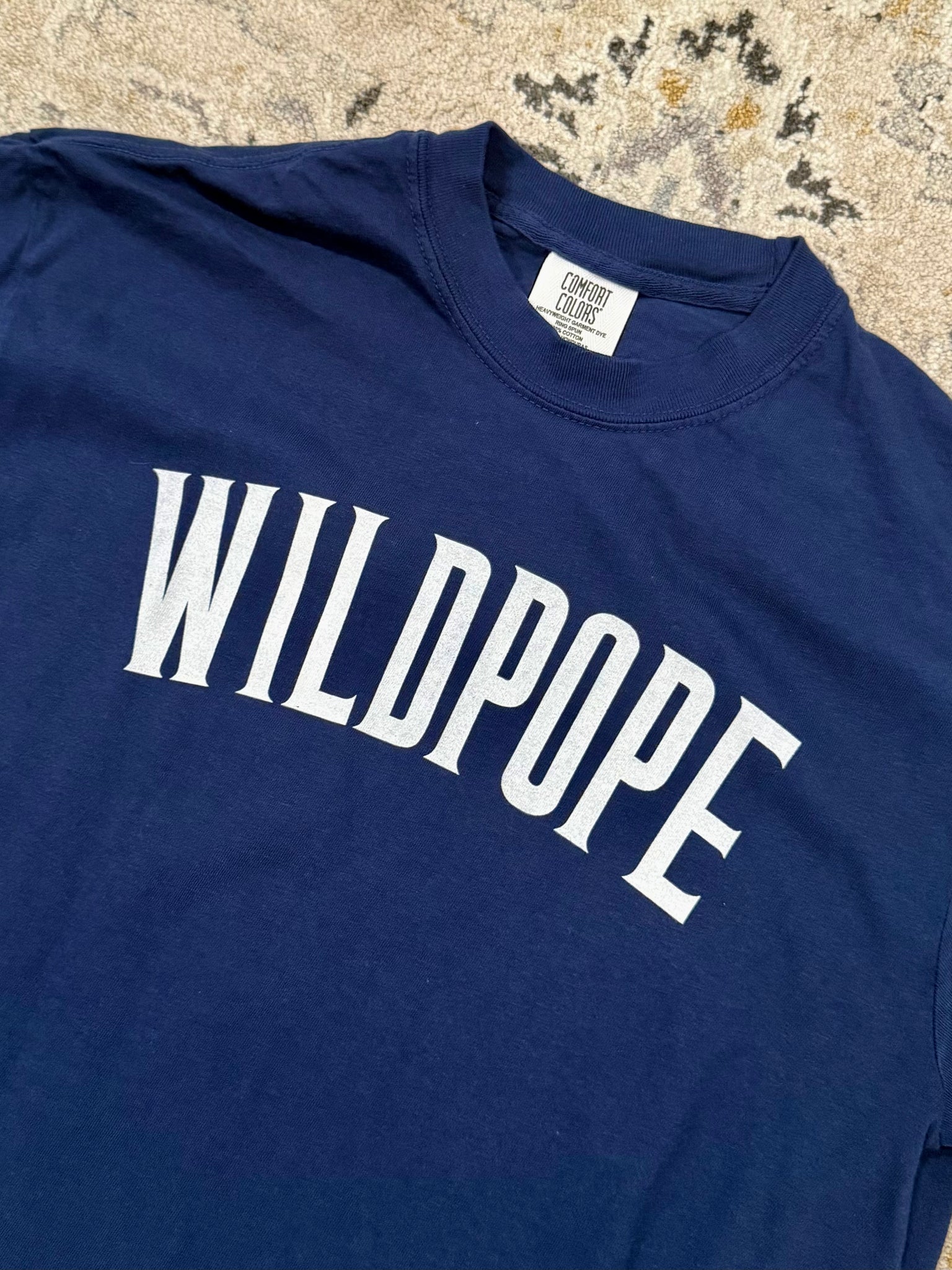 close up of "Wildpope" t shirt celebrating Pope Leo XIV, a Villanova Wildcat